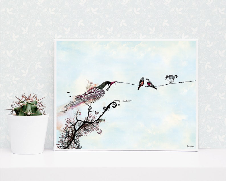 A framed watercolor painting of a bird perched on a branch with a cat and two birds on a wire in the background. The painting is on a white background with a light blue sky. The bird on the branch is detailed with intricate patterns and colors. The cat is black and white and the birds on the wire are red and black. The painting is signed in the bottom right corner.