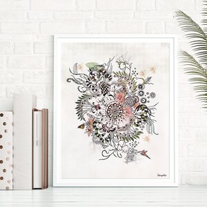 A framed print of a black and white ink drawing of a stylized flower with pink accents on a light gray background. The artist's signature is in the bottom right corner of the print. The print is framed in a white frame.