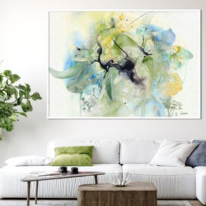 Abstract watercolor painting featuring a blend of blue, green, and yellow hues. The artwork depicts a floral motif with delicate brushstrokes and a sense of movement.