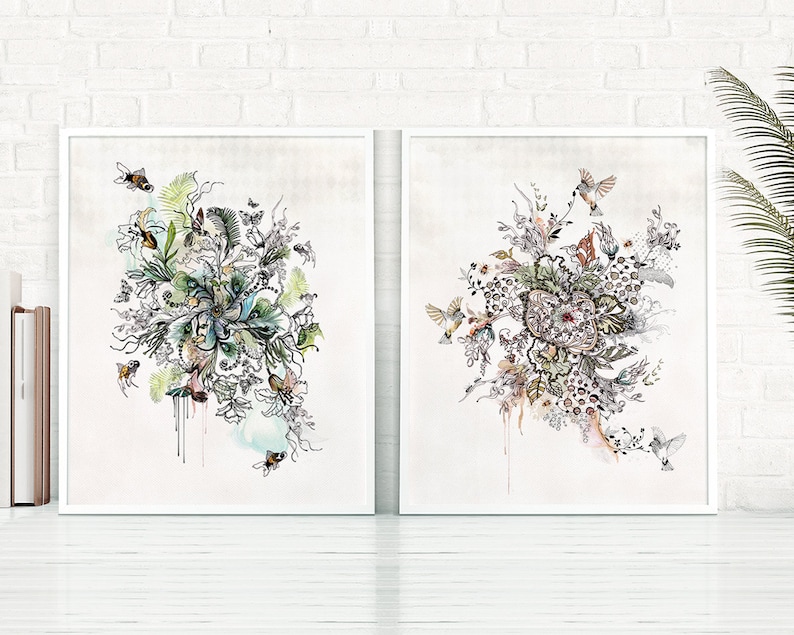 Two framed prints with abstract floral designs in black and white with splashes of color. The designs feature birds and bees.