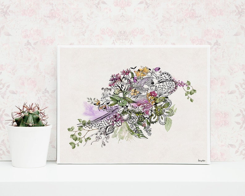 A framed print of a black and white illustration of a bird with flowers and leaves in shades of purple, pink, green, and yellow. The background is a light beige color.