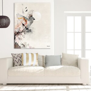 A white canvas print with a watercolor-style illustration of a bird in flight. The bird is gray and white with orange accents and is surrounded by delicate floral details. The background is a soft, muted gray.