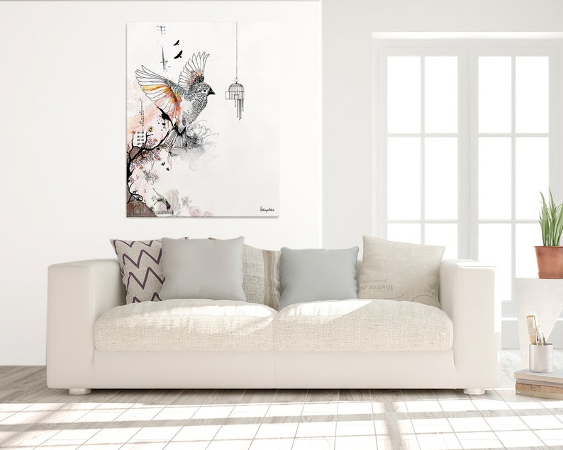 May include: A white, gray, and orange bird with its wings spread, flying away from a small birdcage. The bird is surrounded by a watercolor-style background with pink, gray, and black accents.