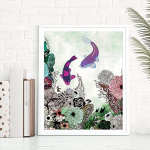 A framed print of a colorful illustration featuring two koi fish swimming in a pond surrounded by flowers and plants. The fish are pink, purple, and black, and the flowers are pink, white, and green. The background is a light green watercolor wash.