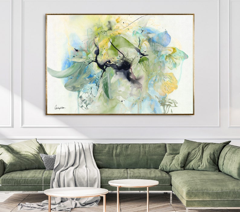 Abstract watercolor painting featuring a large, colorful floral arrangement in shades of blue, green, and yellow. The painting has a soft, ethereal feel and is perfect for adding a touch of nature to any room.