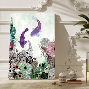 A colorful illustration of two pink and purple koi fish swimming in a pond surrounded by green, pink, and white flowers. The background is a light green watercolor wash.