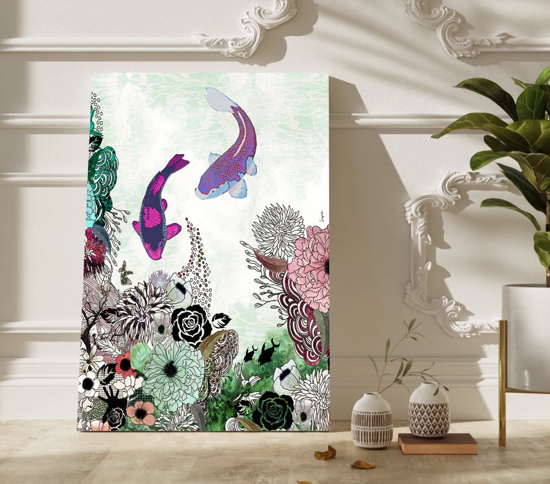 A colorful illustration of two pink and purple koi fish swimming in a pond surrounded by green, pink, and white flowers. The background is a light green watercolor wash.