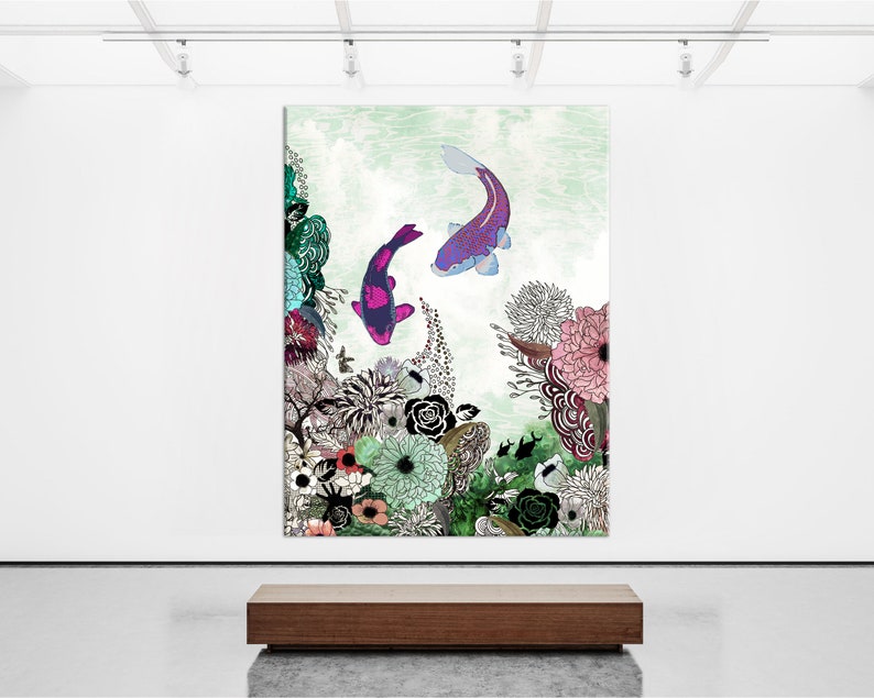 A painting of two purple and pink koi fish swimming in a green and blue water with a floral background. The flowers are in shades of pink, red, green, and blue. The painting is framed and hanging on a white wall.
