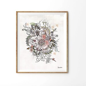 A framed print with a white background and a black and white floral design with pink accents. The design features a large flower in the center surrounded by smaller flowers and leaves. The print is signed 'Daphne' in the bottom right corner.