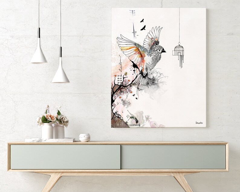 May include: A watercolor painting of a bird with outstretched wings, flying out of a cage. The bird is black and white with orange accents. The background is a soft pink and white watercolor wash with a floral design. The painting is titled "longevity".