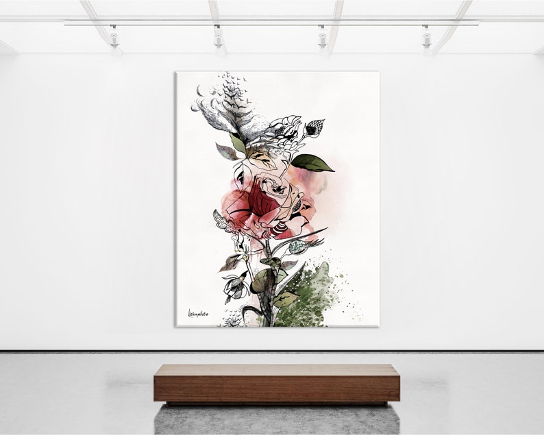 A black and white abstract painting of a rose with pink and red watercolor accents. The painting is displayed in a gallery setting on a white wall with a wooden bench in the foreground.