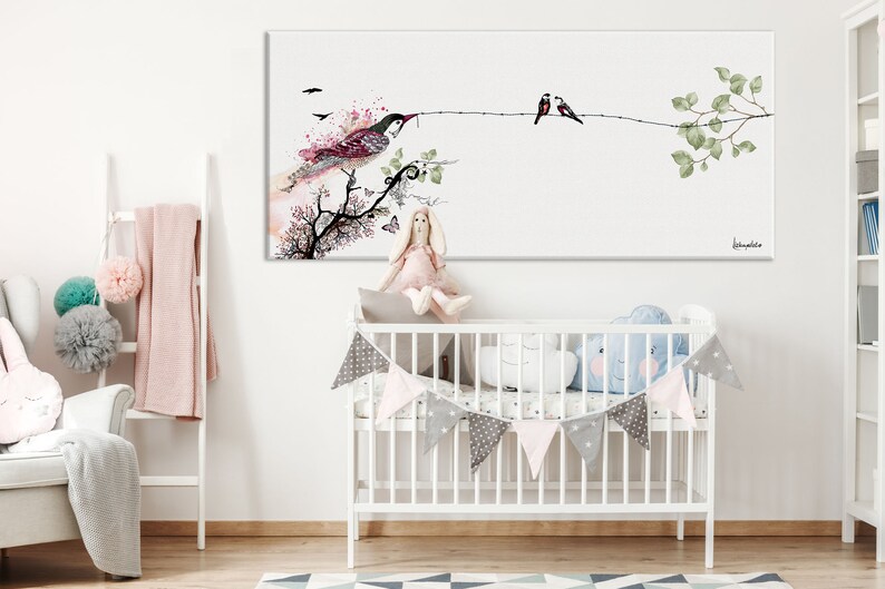 A watercolor painting of birds on a branch hangs above the crib.
