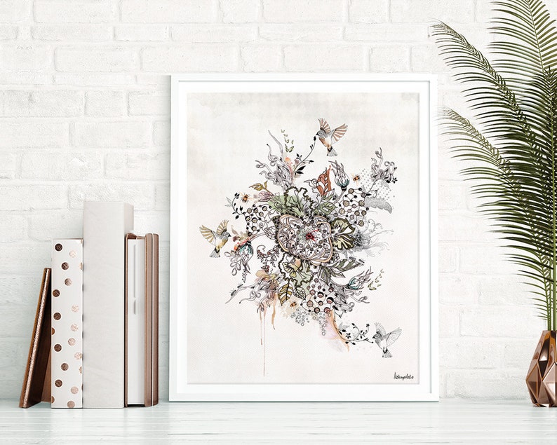 A framed print of a botanical illustration with a white background. The illustration features a cluster of flowers, leaves, and vines in shades of gray, brown, and green. There are also small birds in flight throughout the illustration. The artist's signature is visible in the bottom right corner of the print.