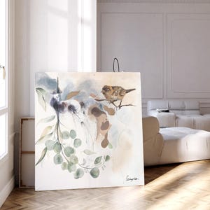 Large watercolor painting featuring muted greens, browns, and blues. The artwork depicts a bird perched on a branch with eucalyptus leaves, set against a soft, abstract background. The painting has a serene and nature-inspired theme, suitable for home or office decor.  The artist's signature is subtly placed in the bottom right corner.