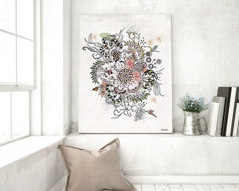 A black and white floral illustration with pink accents on a white background. The illustration is framed and hanging on a white wall above a white shelf with a pillow and a metal pitcher with white flowers.