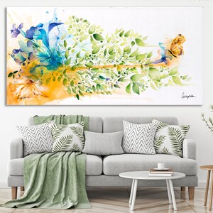 Abstract watercolor painting of a butterfly with green leaves and blue and yellow flowers on a white background.
