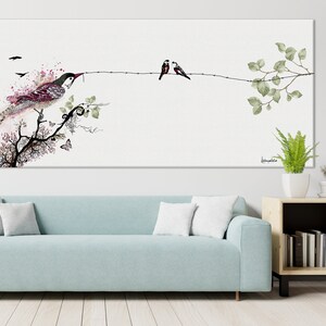watercolor painting of a bird perched on a branch with two other birds on a wire. The painting has a white background with pink and green watercolor accents.