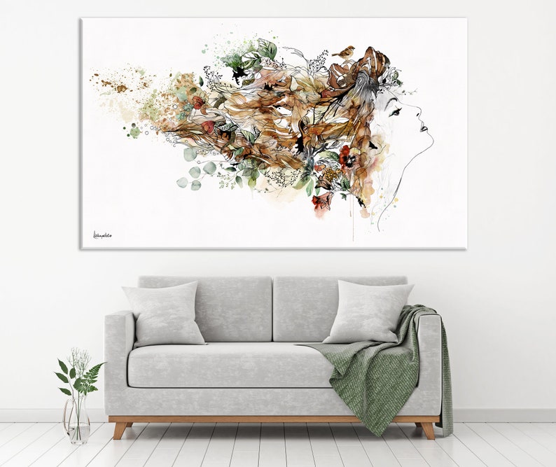 A watercolor painting of a woman's face with flowers and leaves in her hair. The background is white with splashes of gold paint.