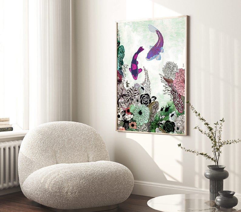 framed print of a colorful illustration of two fish swimming in a floral arrangement. The fish are purple and blue with pink accents. The flowers are a variety of colors including pink, purple, green, and yellow. The background is a light green color.
