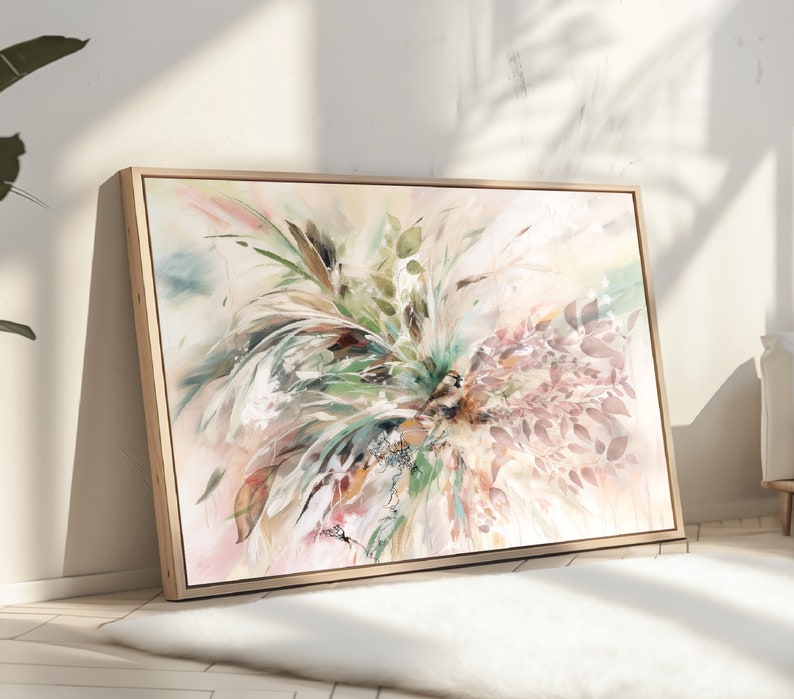 A framed abstract painting with a light background and a variety of colors including green, brown, pink, and white. The painting features a cluster of leaves and branches in a loose, organic style.
