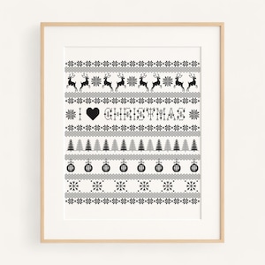 May include: A framed black and white print with a festive Christmas sweater design. The design includes reindeer, snowflakes, Christmas trees, and ornaments. The phrase "I ❤️ CHRISTMAS" is prominently displayed in the center.