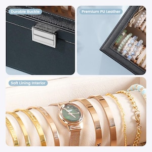 May include: A black jewelry box with a durable buckle and soft lining. The box contains a variety of gold bracelets and a rose gold watch with a green face. The top right corner shows a section with bracelets and beads.