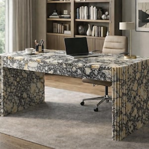 May include: A rectangular desk featuring a prominent black and white marble pattern with a high-gloss finish. The desk has a solid, thick top and two wide, vertical side supports with a fluted, ribbed texture along the outer edges.