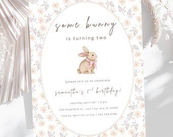 May include: A floral-patterned invitation card with the text "Some bunny is turning two." An illustration of a bunny with a pink bow is in the center. The card also includes birthday details.
