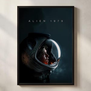 May include: Framed poster featuring a person in a space helmet, with the text "ALIEN 1979" at the top. The image has a dark, cinematic aesthetic, with the person's face illuminated within the helmet.