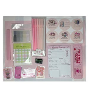 May include: A pink stationery set with stickers, pens, sticky notes, and a bookmark. The set includes stickers with the text "This book belongs to" and "Hot girls read books". Also included is a book review sheet.