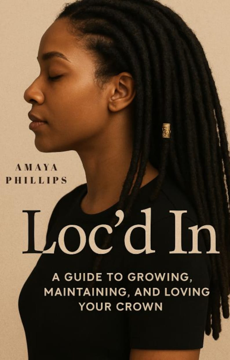 May include: Book cover with a woman with black locs and a gold hair accessory. The book is titled "Loc'd In" by Amaya Phillips. The subtitle reads "A Guide to Growing, Maintaining, and Loving Your Crown."