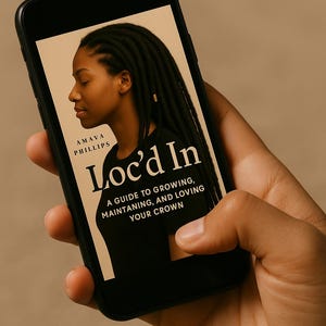May include: A smartphone screen shows the book cover of "Loc'd In" by Amava Phillips. The cover features a side profile of a person with locs. The book's subtitle reads: "A guide to growing, maintaining, and loving your crown."
