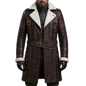 May include: A brown leather coat with a white shearling collar and cuffs. The coat features a belted waist, multiple buckles, and a quilted white lining. The sleeves have brown stripes and the coat is buttoned up.
