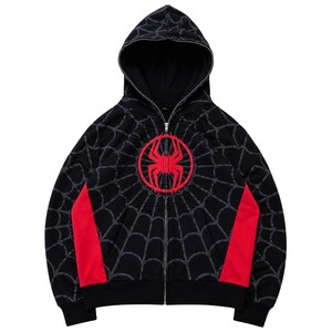 Black Red Spider Web Zip Hoodie flat lay product front view clean background