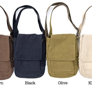 May include: Four canvas messenger bags in brown, black, olive, and khaki. Each bag has a flap closure, adjustable shoulder strap, and a front pocket. The bags are displayed against a white background.