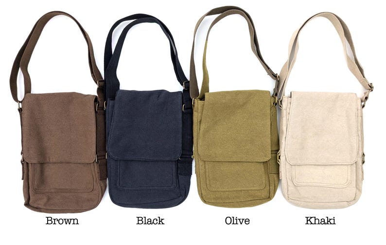 May include: Four canvas messenger bags in brown, black, olive, and khaki. Each bag has a flap closure, adjustable shoulder strap, and a front pocket. The bags are displayed against a white background.