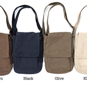 May include: Four canvas messenger bags in different colors: brown, black, olive, and khaki. Each bag has a flap closure and an adjustable shoulder strap.