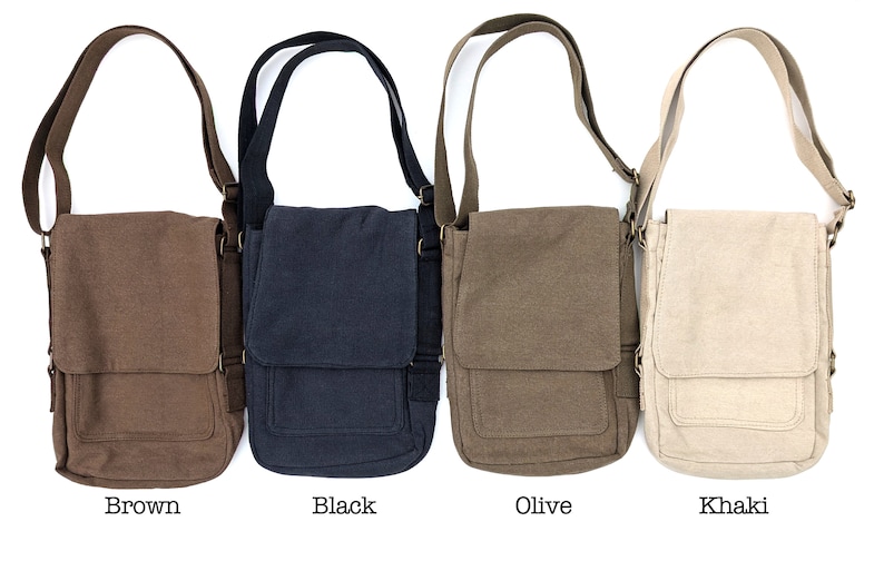 May include: Four canvas messenger bags in different colors: brown, black, olive, and khaki. Each bag has a flap closure and an adjustable shoulder strap.