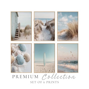 May include: A set of six framed wall art prints featuring coastal scenes including a beach house, sand dunes, seashells, a surfboard on the sand, and ocean waves with birds. The text below the prints reads PREMIUM Collection SET OF 6 PRINTS.