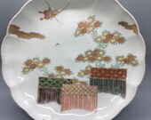 Set of eight rare vintage Japanese Imari scalloped, fluted porcelain plates - a garden scene with chrysanthemums, butterflies, and fences