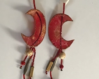 Beautiful and light weight post earrings  made by Carolyn Barrett - hand painted red and gold crescent moons with an oriental flare