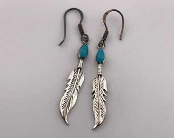 Native American designed feather earrings with turquoise inlay