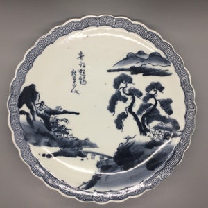 Vintage Japanese dark bluish grey and white hand painted plate with scalloped edges and beautiful landscape scene