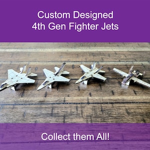 May include: Four custom-designed 4th Gen fighter jets made of light-colored wood are displayed on a wooden surface. The text "Custom Designed 4th Gen Fighter Jets" and "Collect them All!" are visible.