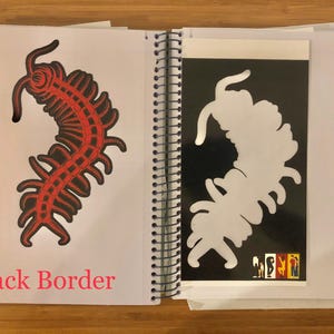 May include: An open spiral-bound sketchbook displays two illustrations of a centipede-like creature. One is red and black on white, the other is a white silhouette on black. The text "Black Border" is at the bottom.