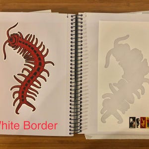 May include: Open sketchbook with a red and black centipede illustration on the left page and a centipede stencil on the right. The text "White Border" is visible at the bottom left of the left page. The sketchbook is open on a wooden surface.