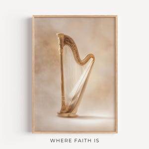 May include: A framed print of a golden harp with strings, set against a soft, neutral background. The harp is detailed with ornate carvings and stands out with its warm, metallic tones. The text "WHERE FAITH IS" is at the bottom.