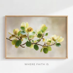 May include: A framed print depicting a branch with green, yellow, and brown leaves. The leaves have detailed veins, and the branch is set against a soft, neutral background. The text "WHERE FAITH IS" is at the bottom of the image.