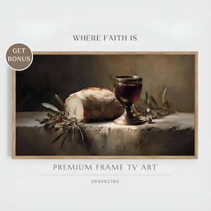 May include: A still life painting featuring a loaf of bread, a chalice of red wine, and olive branches. The artwork is framed and includes the text "WHERE FAITH IS" and "PREMIUM FRAME TV ART".