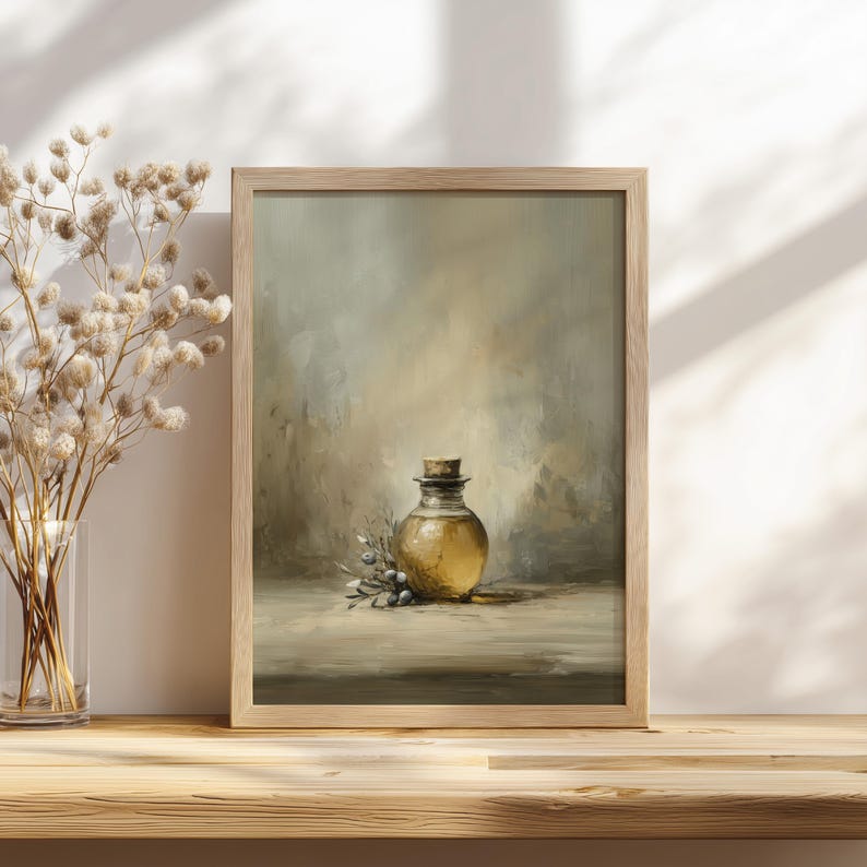 May include: A framed print of a still life painting featuring a round glass bottle with a cork stopper. The bottle is filled with a golden liquid and is surrounded by sprigs of greenery. The artwork has a neutral color palette.